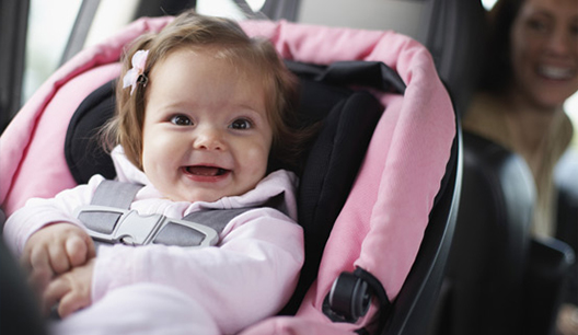 Child buckled into a car seat.